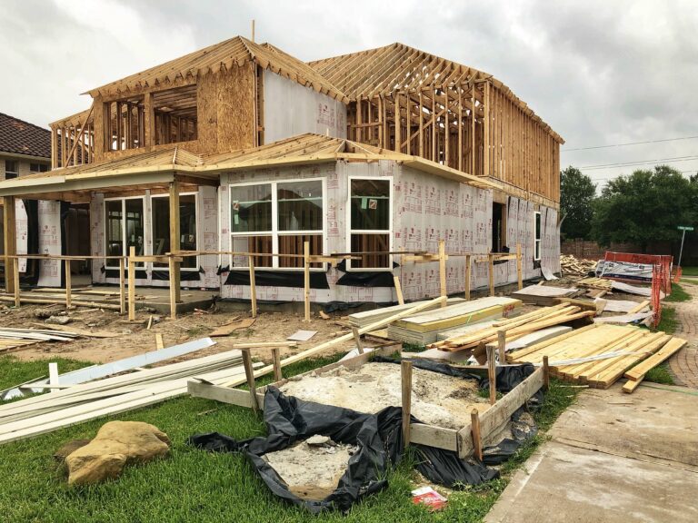A modern home in Houston featuring elevated foundations, reinforced concrete walls, and impact-resistant windows designed to withstand hurricanes.